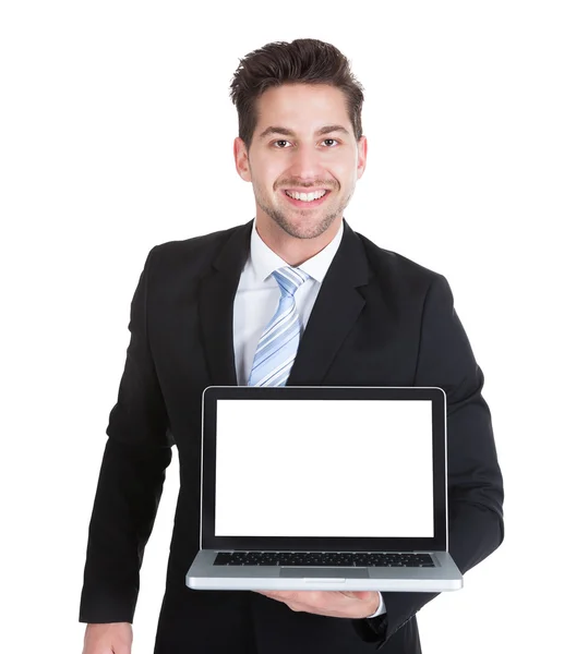 Businessman showing Laptop — Stockfoto