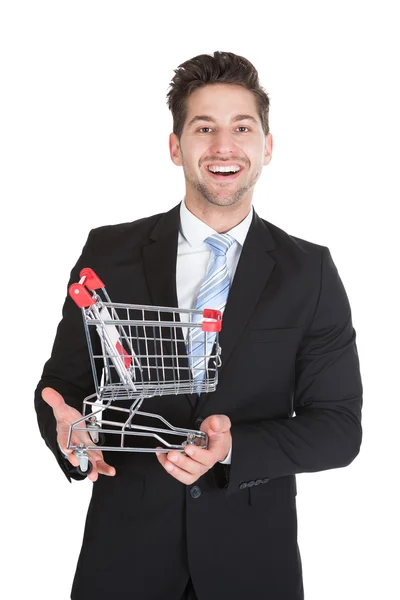 Geschäftsmann mit Einkaufswagen-Modell — Stockfoto