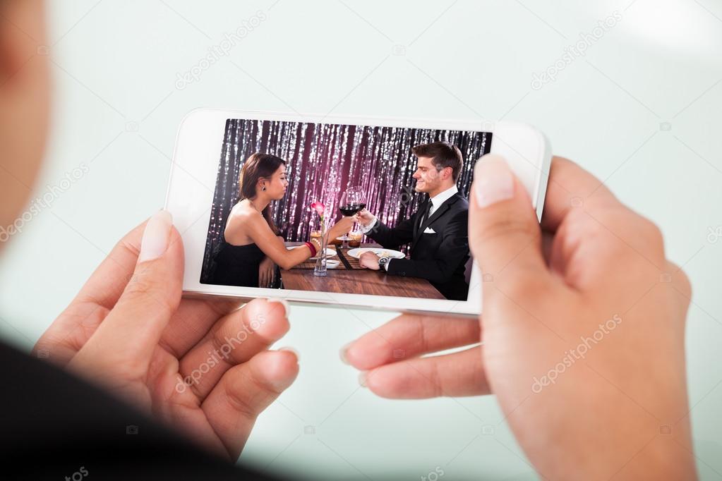 Businesswoman Watching Couple Toasting