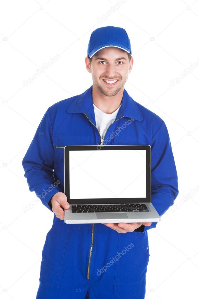Mechanic showing Laptop