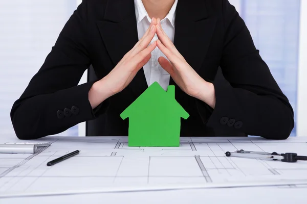 Businesswoman Protecting Green House — Stock Photo, Image