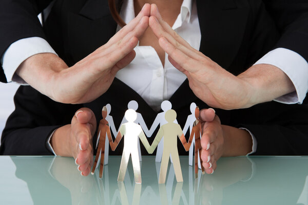 Business People Sheltering Team