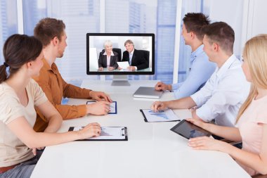 Businesspeople in conference room clipart