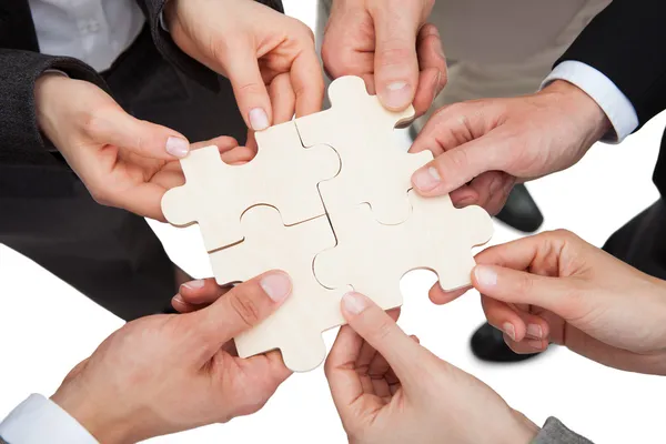 Businesspeople Fixing Jigsaw Pieces — Stock Photo, Image