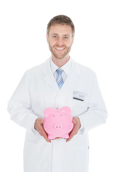 Läkare anläggning piggybank — Stockfoto