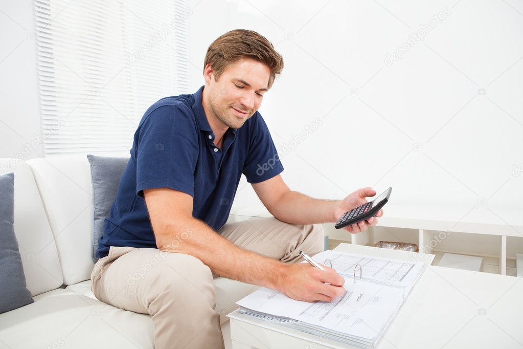 Man Calculating  Finances
