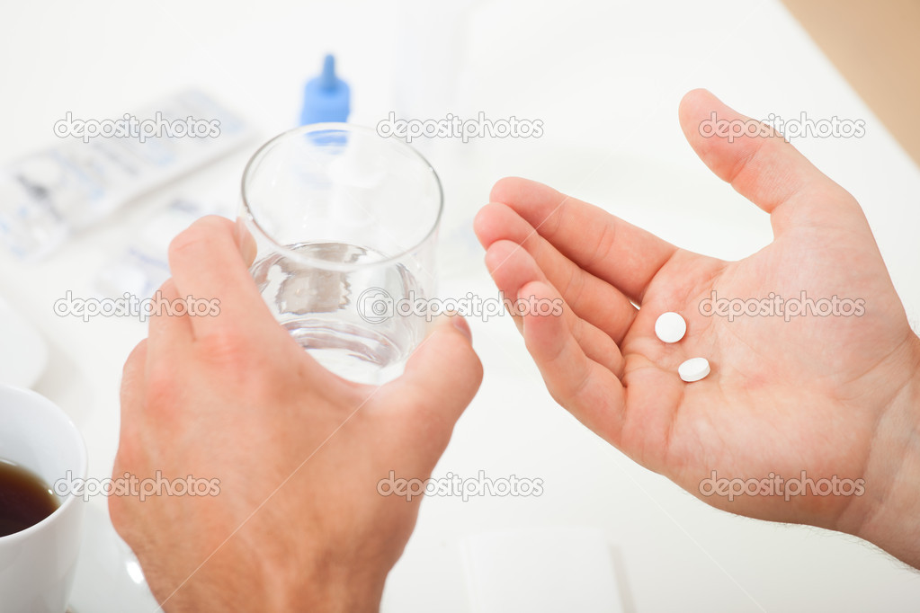 Hands Holding Pills