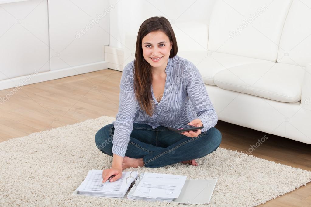 Woman Calculating Home Finances