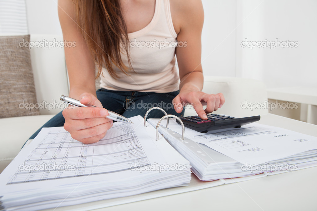 Woman Calculating Home Finances