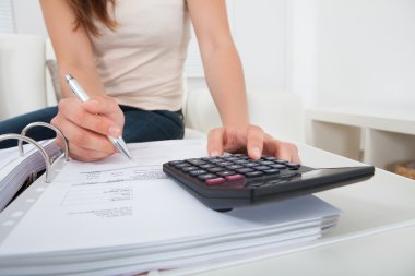 Woman calculating home finances