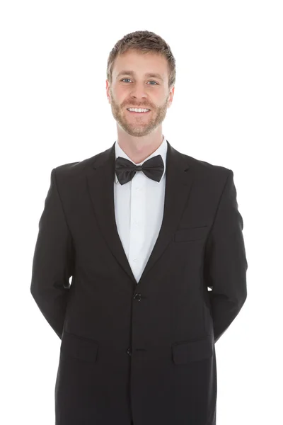 Confident waiter standing hands behind back — Stock Photo, Image