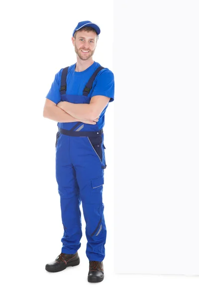 Male worker standing arms crossed — Stock Photo, Image