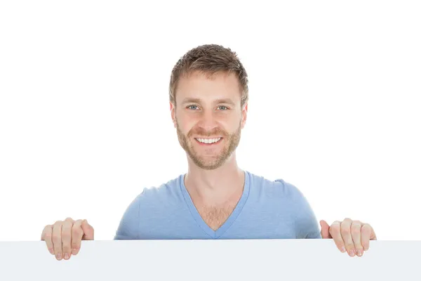 Man looking at blank billboard — Stock Photo, Image