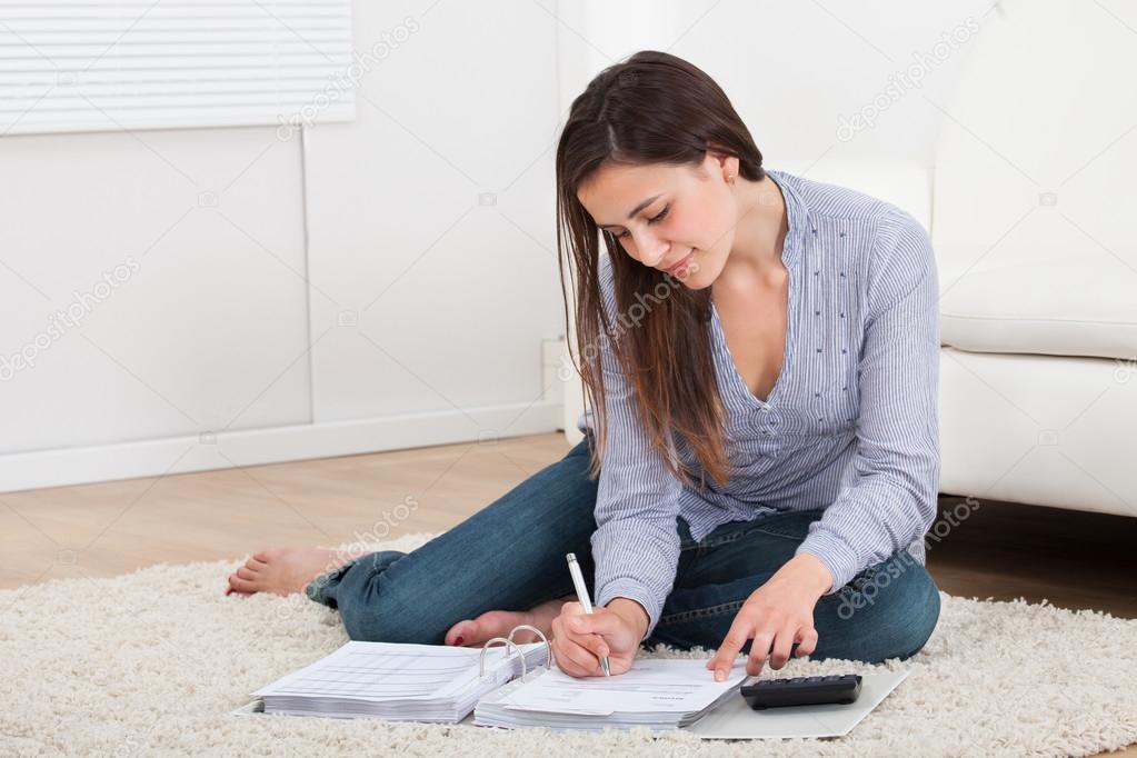 Woman Calculating Home Finances