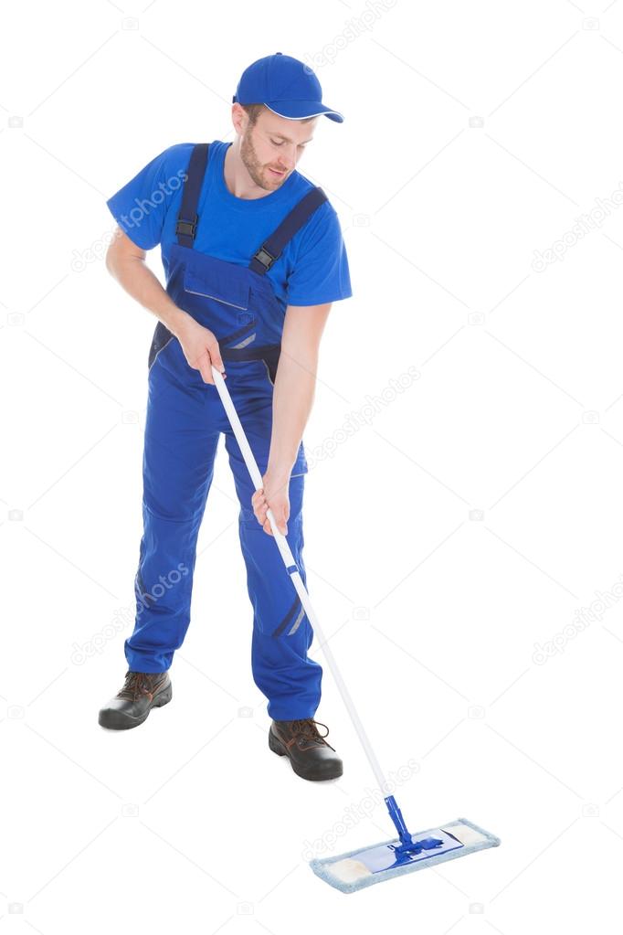 Male servant mopping floor Stock Photo by ©AndreyPopov 51170727