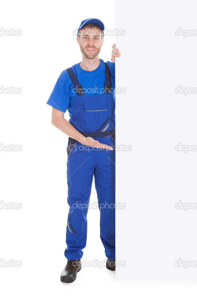 Smiling manual worker with billboard