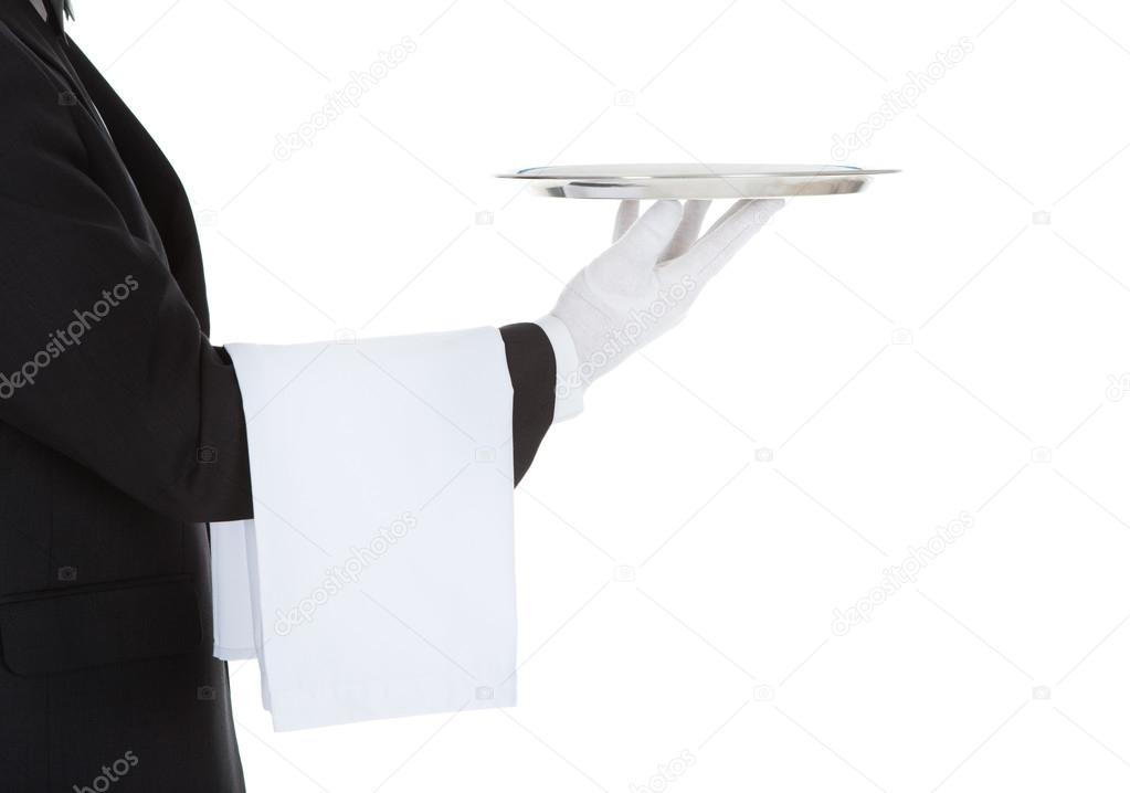 Waiter holding empty tray