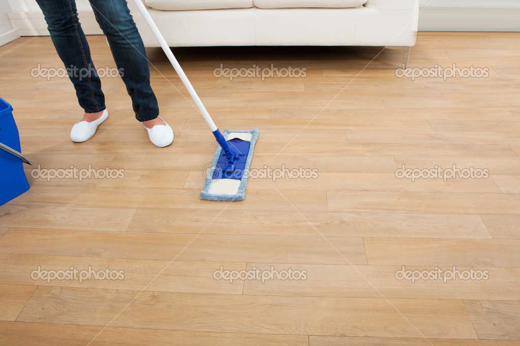Woman Mopping Hardwood Floor — Stock Photo © AndreyPopov 51171347