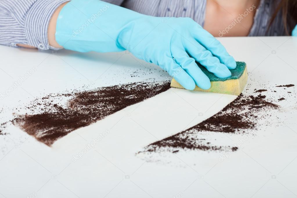 Hand Cleaning Dirt With Sponge