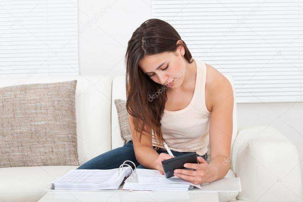 woman calculating home finances