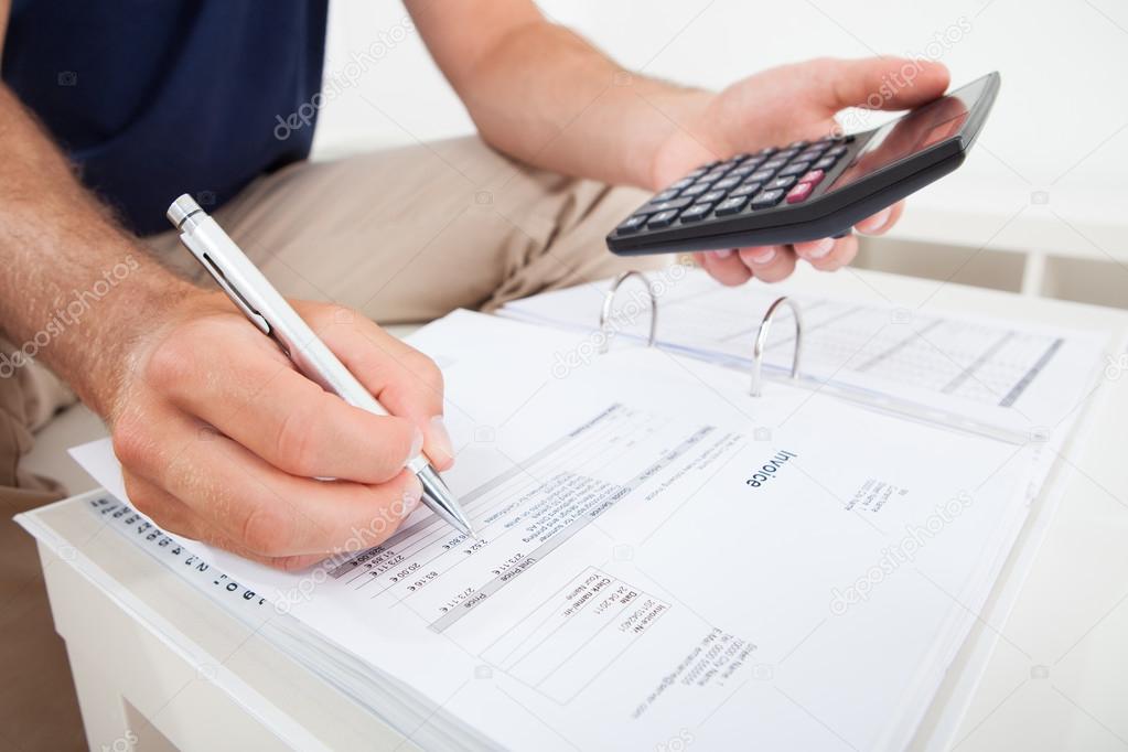 Man Calculating Home Finances