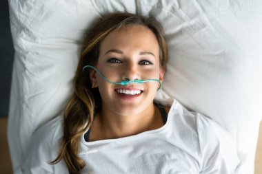 Sick Patient With Nasal Cannula. Ill Woman With Respiratory Disease clipart
