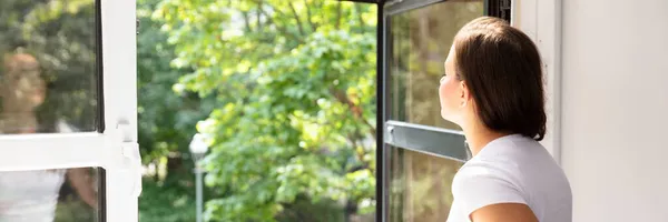 Fresh Air From Window. Side View Of Woman Breathing