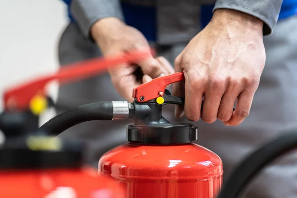 Fire Extinguisher Safety Prevention Check. Emergency Equipment Inspection