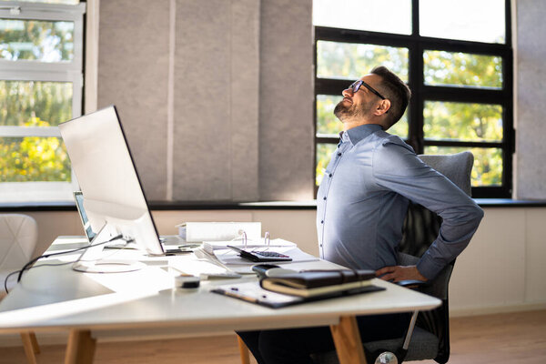 Back Pain Bad Posture Man Sitting In Office