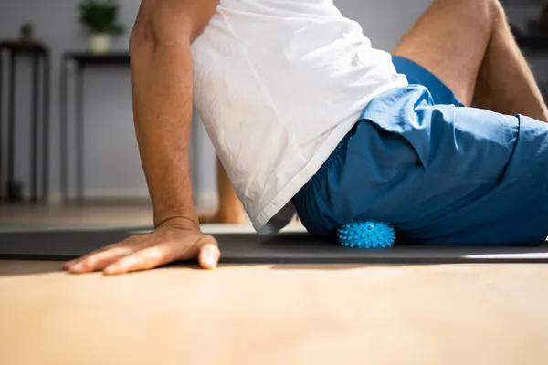 Glutes Trigger Point Massage Using Spiky Ball Myofascial Release — 스톡 사진