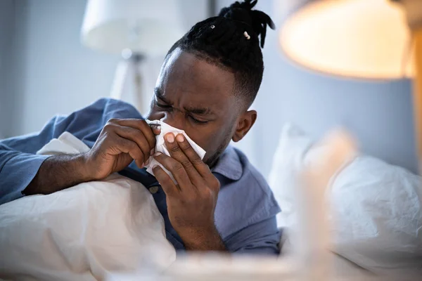 African American Man Blowing Nose Sneezing Bed — Stock Photo, Image