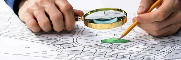 Human Hand Holding Pencil Paper Cadastre Map — Zdjęcie stockowe