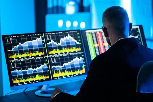 stock image Stock Trader Man Using Multiple Computer Monitors