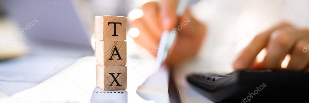 Earned Income Tax In Office. Finance And Taxation Concept
