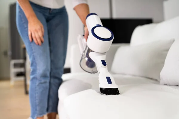 Young Female Worker Cleaning Sofa Vacuum Cleaner — Stock Fotó