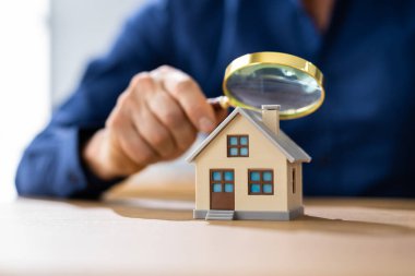 Real Estate House Appraisal By Inspector With Magnifier clipart