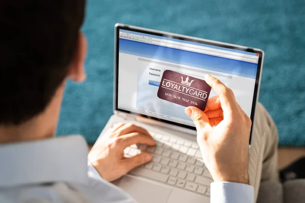 Man Hand Holding Vip Member Card While Using Laptop — Stock Photo, Image