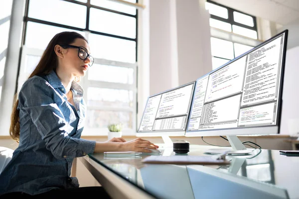 Programmer Woman Coding Multiple Computer Screens — Stock Photo, Image