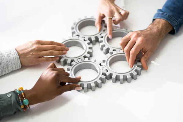 Group Businesspeople Joining Together Gears Table Workplace — Stock Photo, Image