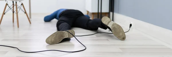 Elevated View Man Stumbling Electrical Cord — Stock Photo, Image