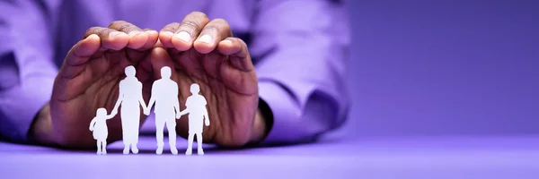 Businessperson Hand Protecting Family Figure Cut Out — Stock Photo, Image