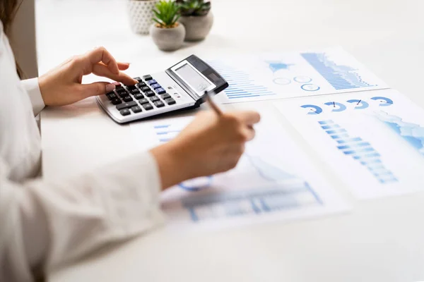Business Accountant Using Finance Chart Document Calculator — стоковое фото