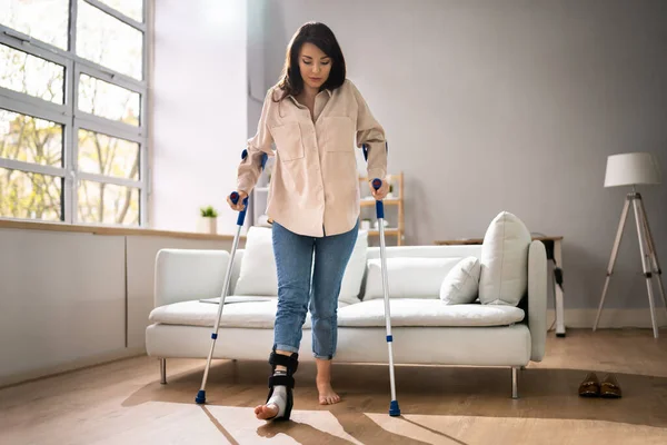Hurt Leg Using Crutches Couch Home — Foto de Stock