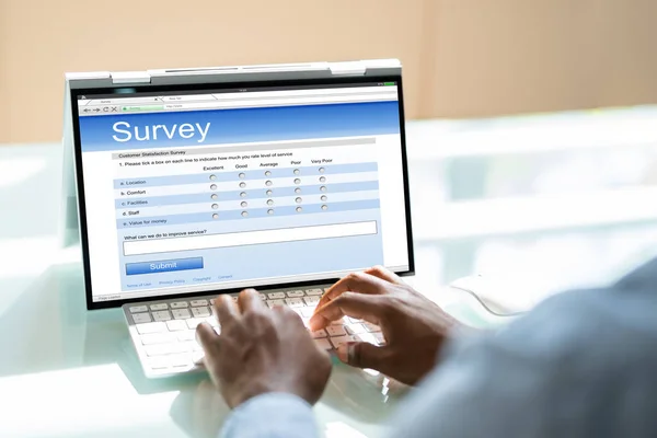 African Man Filling Survey Poll Form Laptop Computer — Stock Photo, Image
