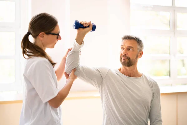 Physical Rehabilitation Therapist Helping Man Physiotherapy Rehabilitation — ストック写真