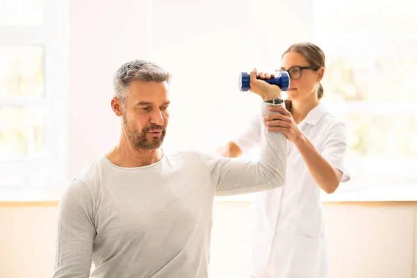 Physical Rehabilitation Therapist Helping Man Physiotherapy Rehabilitation — Fotografia de Stock