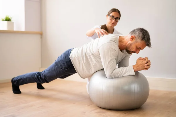 Physical Physiotherapy Rehabilitation Professional Therapist Exercising Patient — ストック写真