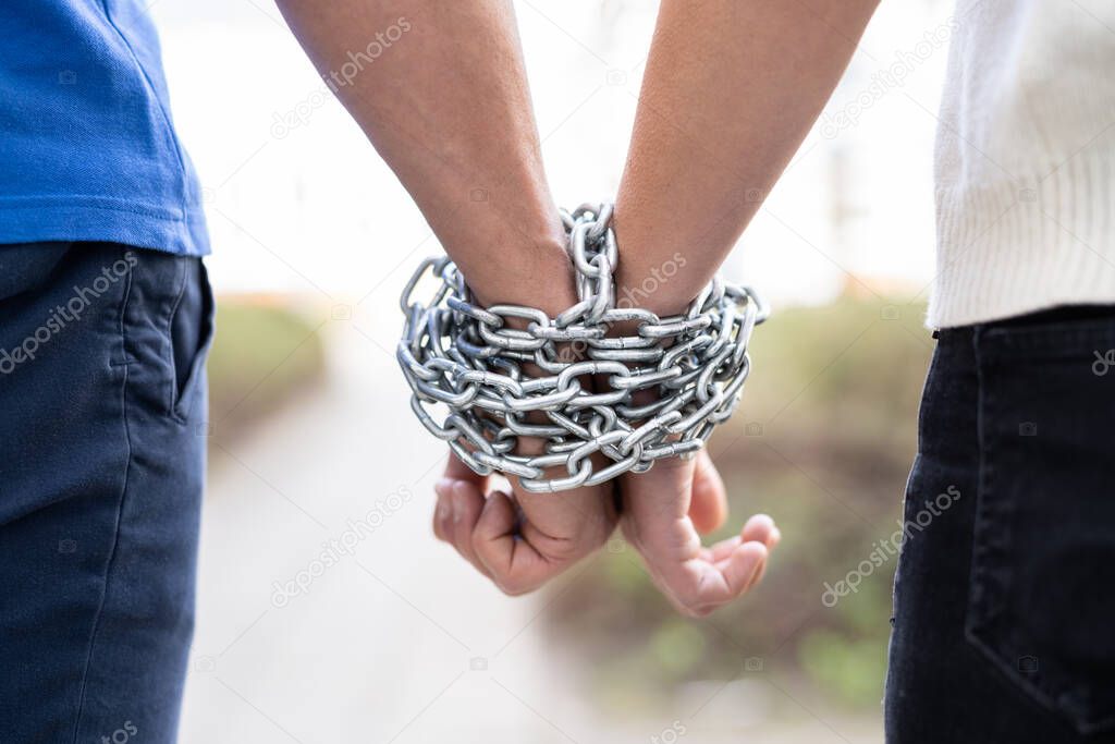 Couple Codependent Relationship. Partner Hands Chained Together