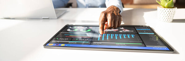 African Businessman Using Analytics Data KPI Dashboard Tech