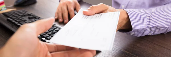 Close Businessman Giving Cheque Her Colleague Workplace Office — Stock Photo, Image